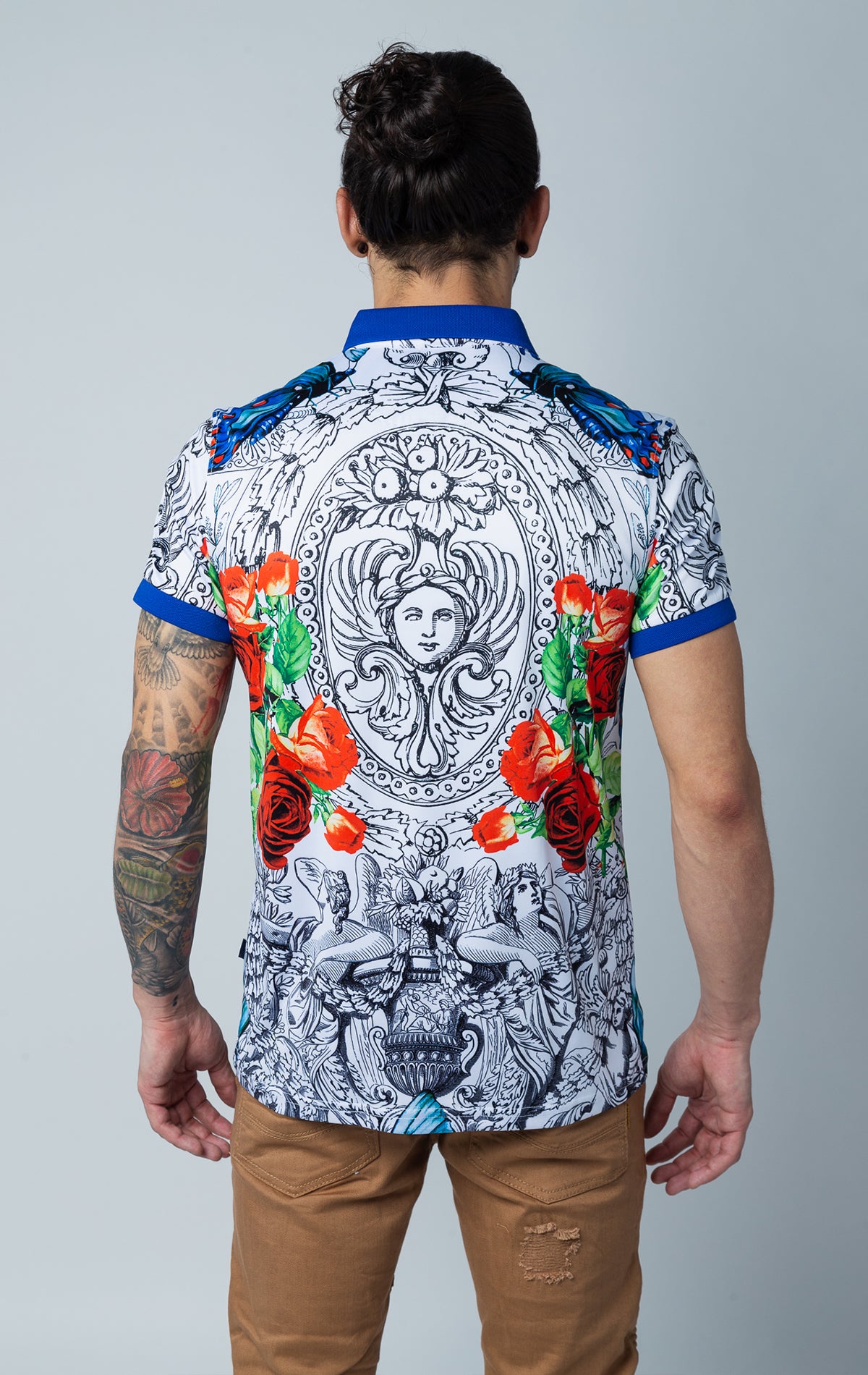 Men's printed Medusa, floral, and animal pattern short-sleeve polo shirt with contrasting royal collar and three-button closure.