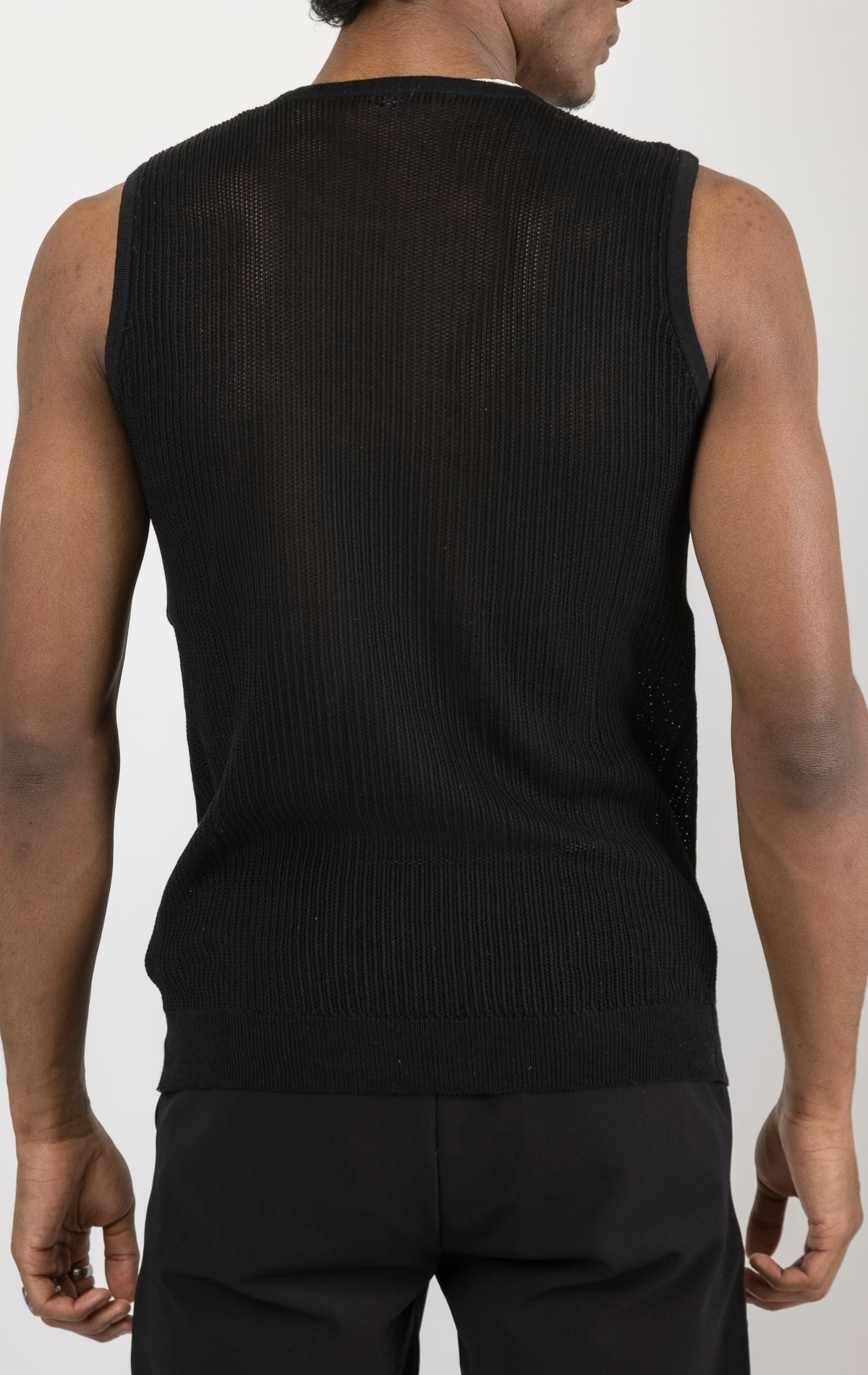 Men's crew neck mesh tank top in black. The tank top is made from a lightweight and breathable mesh fabric (50% cotton, 50% acrylic) and features a sleeveless construction and a tailored fit.