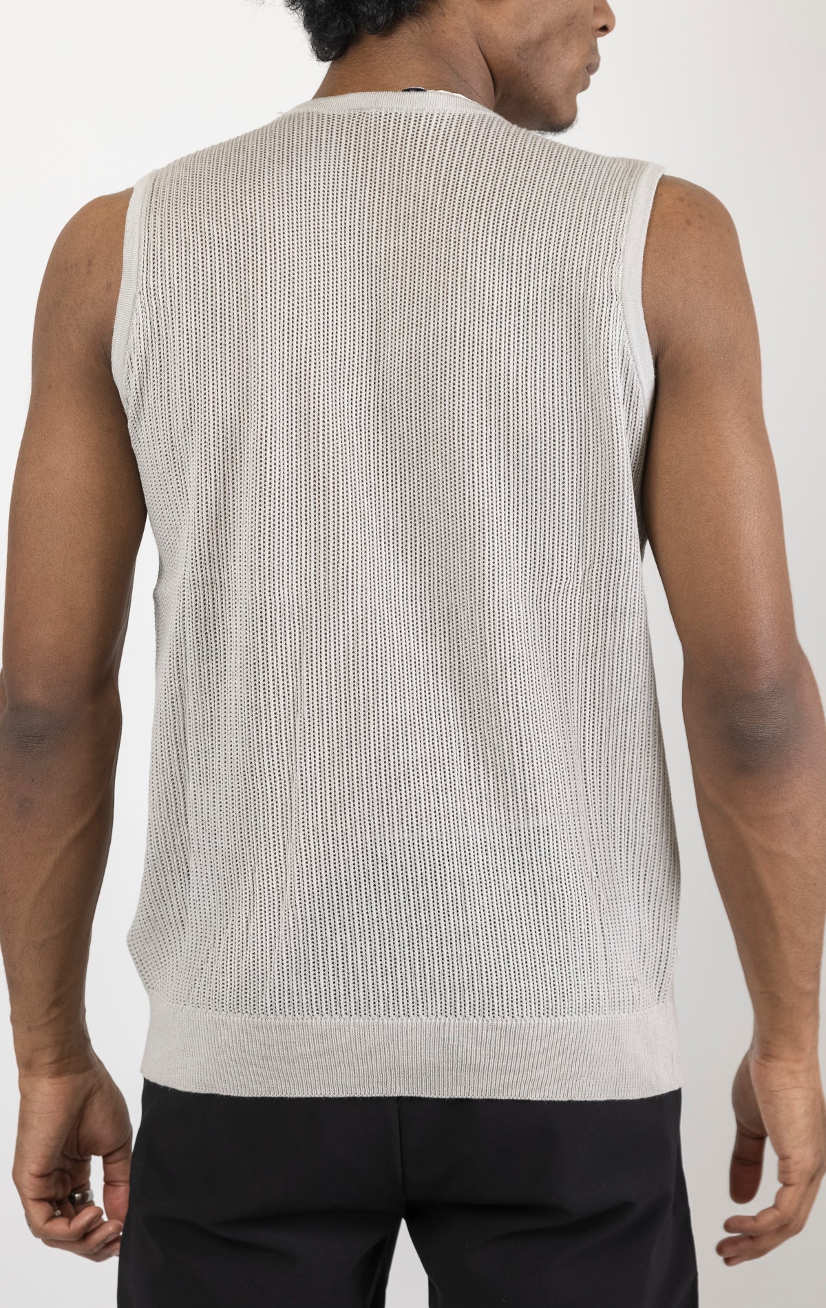 Men's crew neck mesh tank top in grey. The tank top is made from a lightweight and breathable mesh fabric (50% cotton, 50% acrylic) and features a sleeveless construction and a tailored fit.