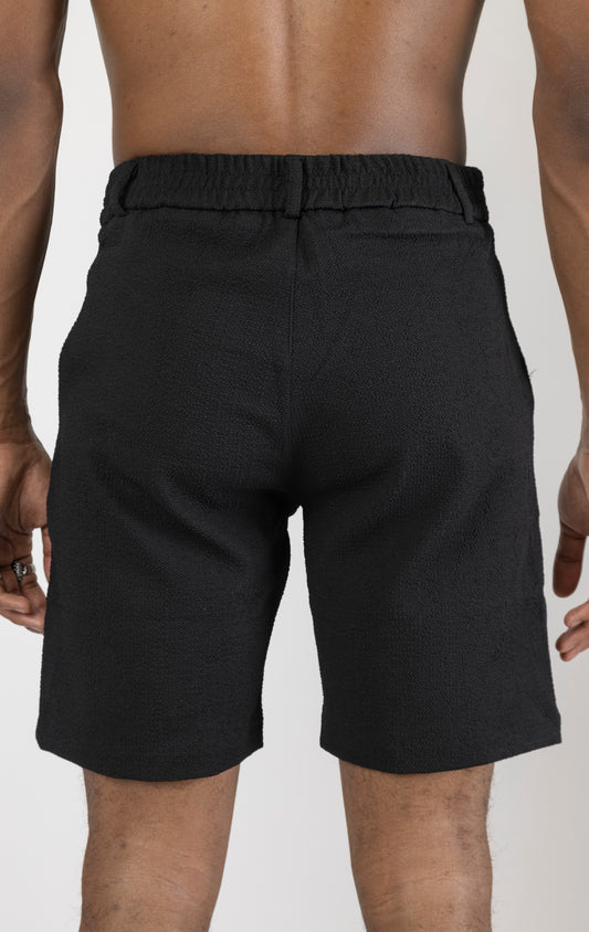 Men's elegant everyday shorts in black. The shorts are made from a blend of polyester (74%), viscose (24%), and elastane (2%) and feature a tailored fit and a versatile length.