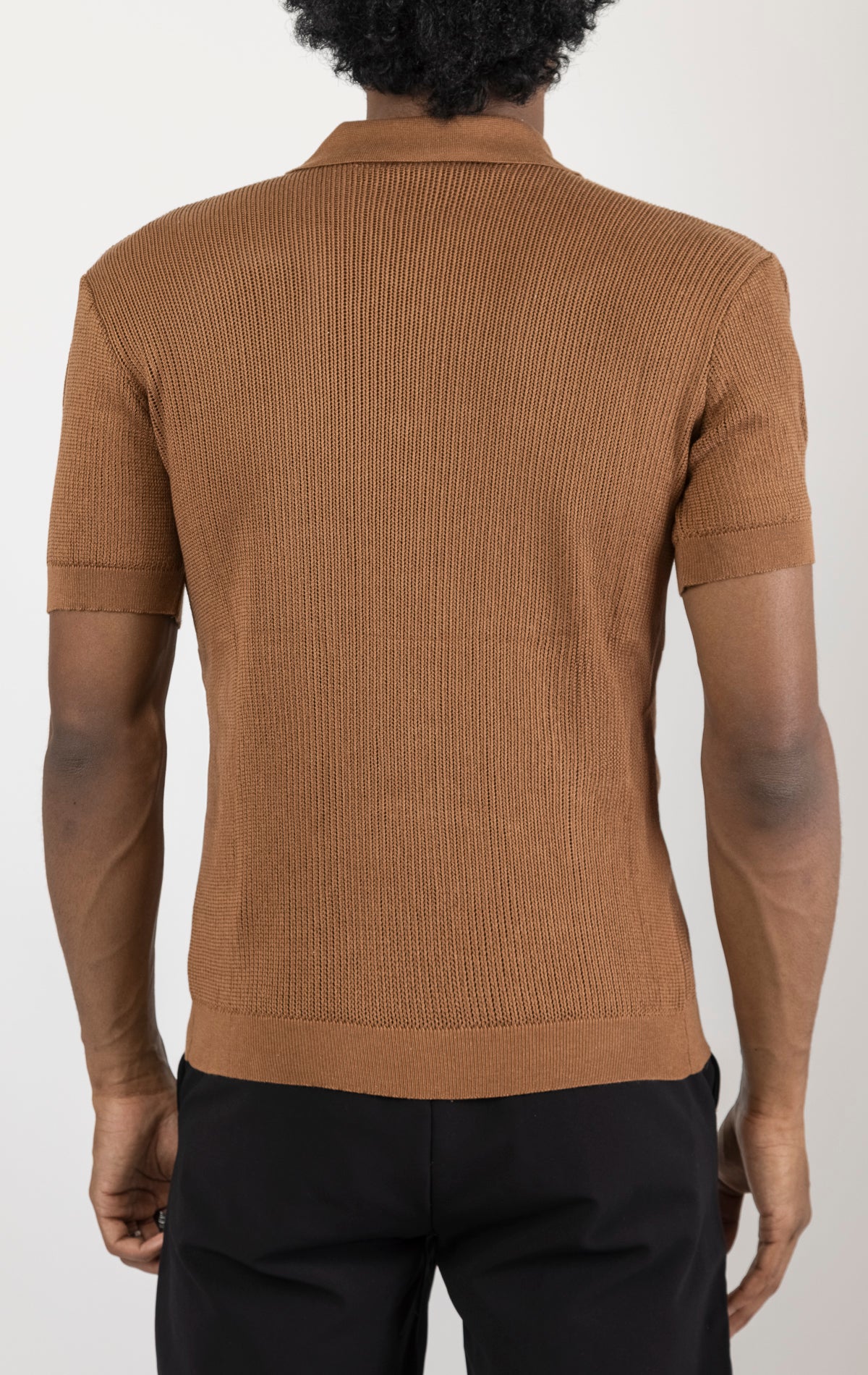 Men's see-through button-down mesh top in brown. The top is made from a 50% cotton, 50% acrylic blend and features a tailored fit with a sheer mesh fabric and button-down closure.