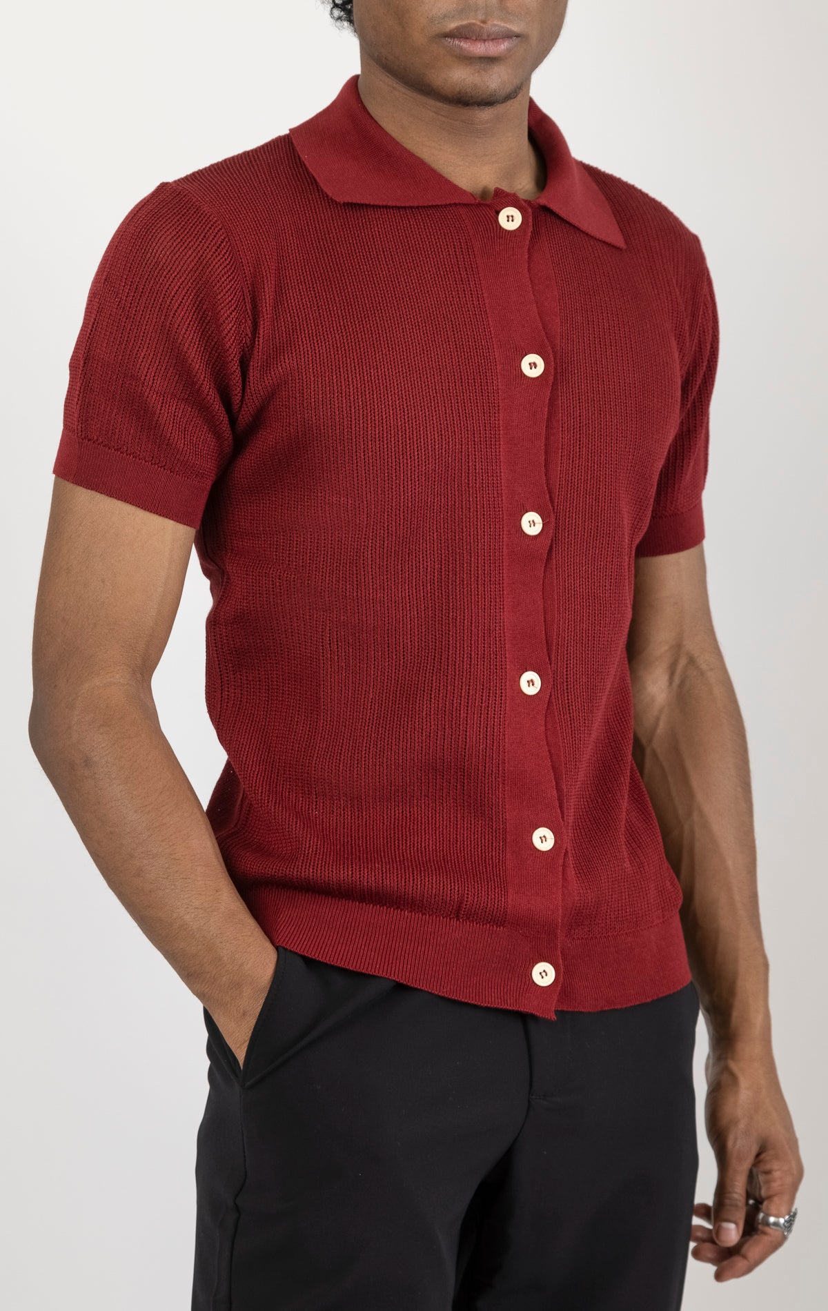 Men's see-through button-down mesh top in burgundy. The top is made from a 50% cotton, 50% acrylic blend and features a tailored fit with a sheer mesh fabric and button-down closure.