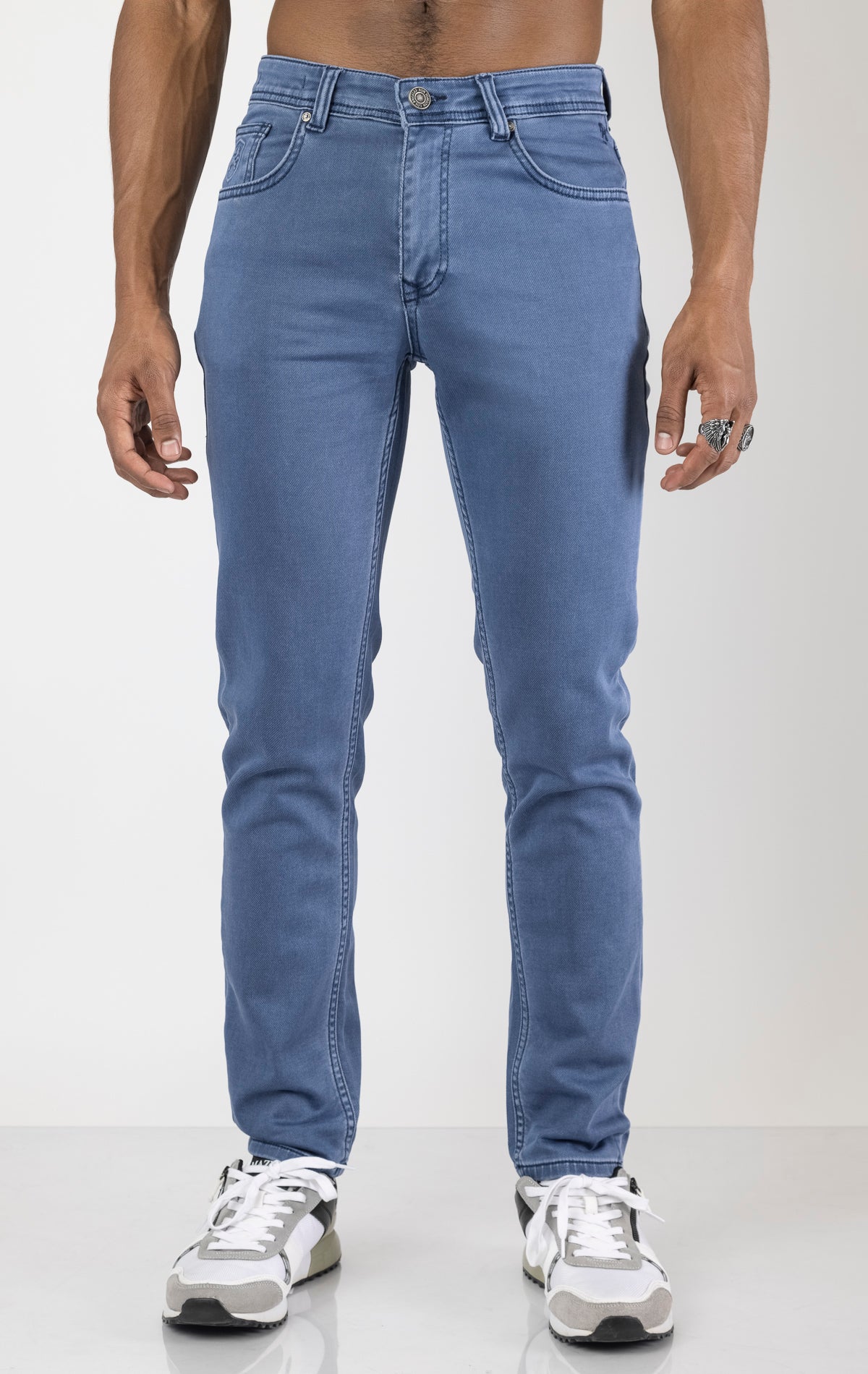 Men's super soft 5-pocket style pants in indigo color. The pants are made from a 98% cotton, 2% elastane blend and feature a tailored fit with a hint of stretch, classic 5-pocket styling (two front pockets, two back pockets, and a coin pocket).