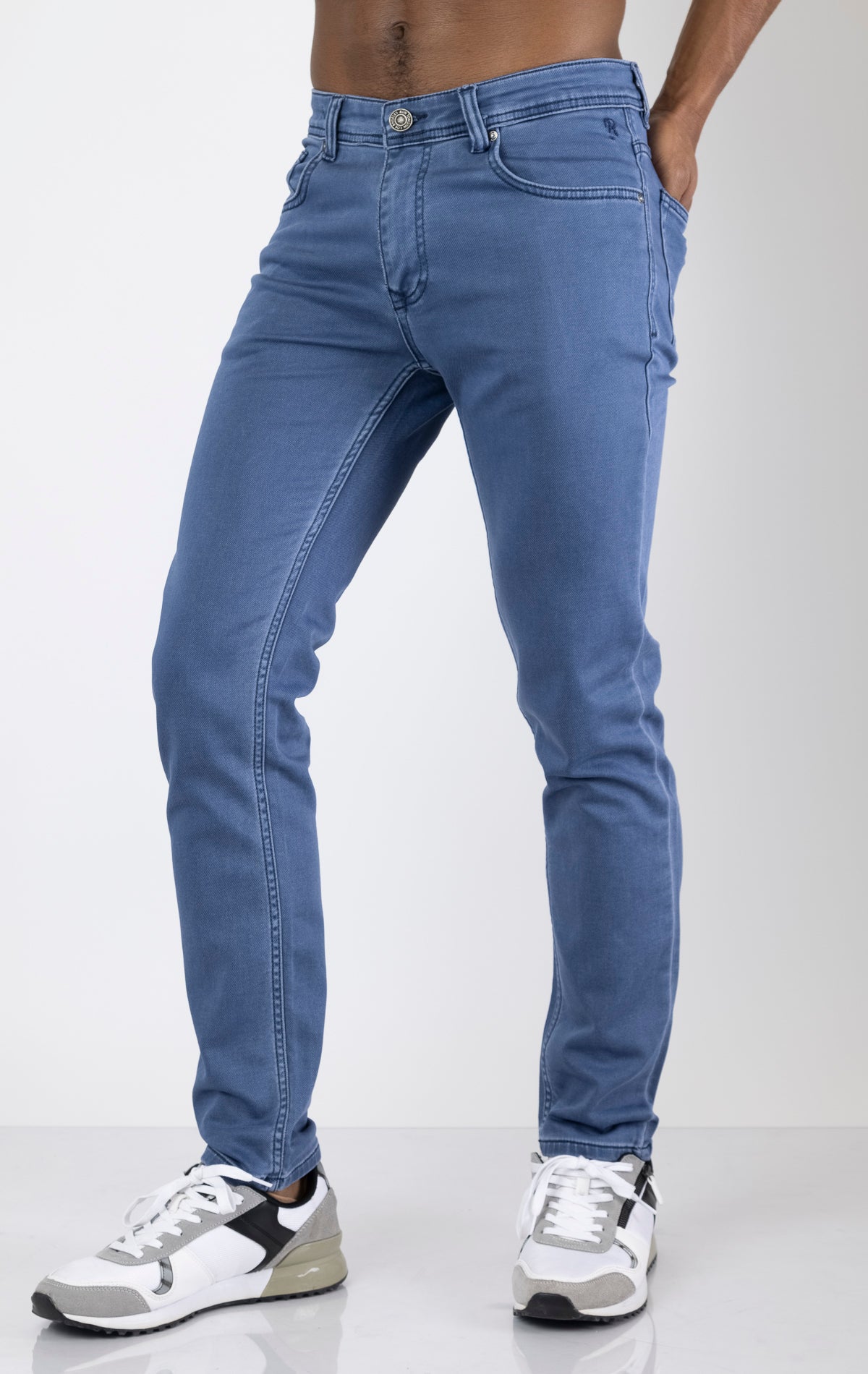 Men's super soft 5-pocket style pants in indigo color. The pants are made from a 98% cotton, 2% elastane blend and feature a tailored fit with a hint of stretch, classic 5-pocket styling (two front pockets, two back pockets, and a coin pocket).