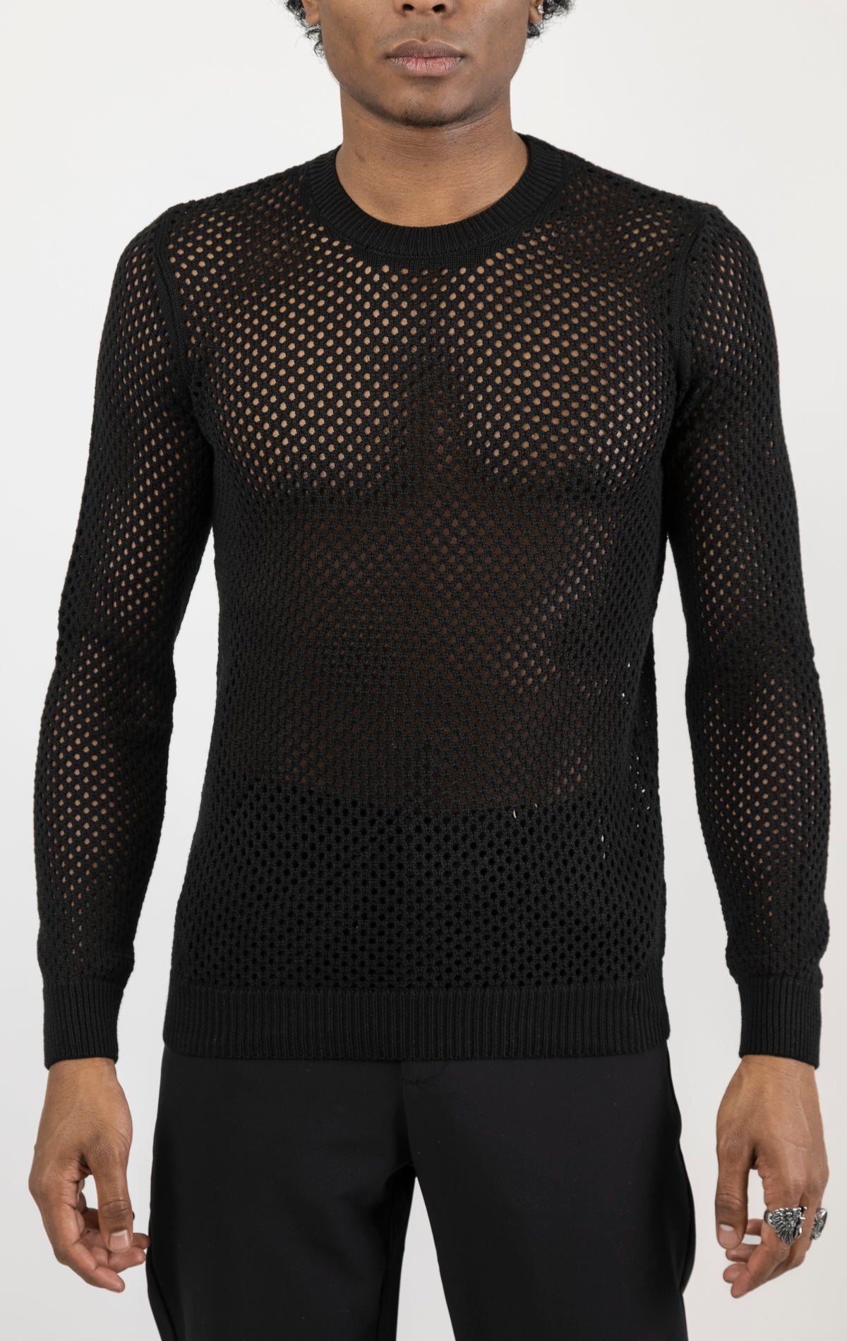 Men's see-through fishnet muscle fit shirt in black. The shirt is made from a 50% cotton, 50% acrylic blend and features a muscle fit silhouette with a see-through fishnet fabric design.
