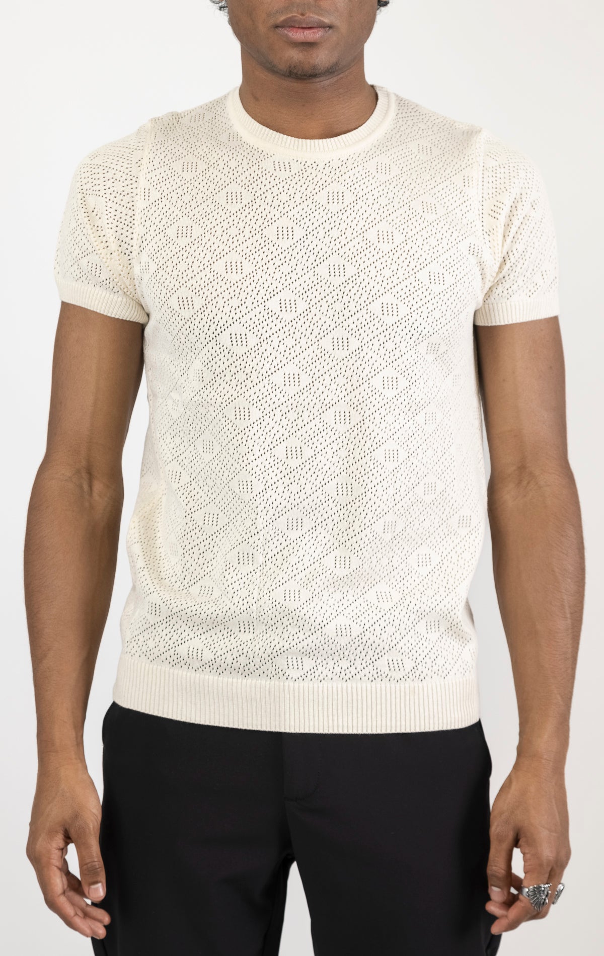 Women's geometric crochet knit top in beige. The top is made from a 50% viscose, 50% polyamide blend and features a unique geometric crochet pattern.