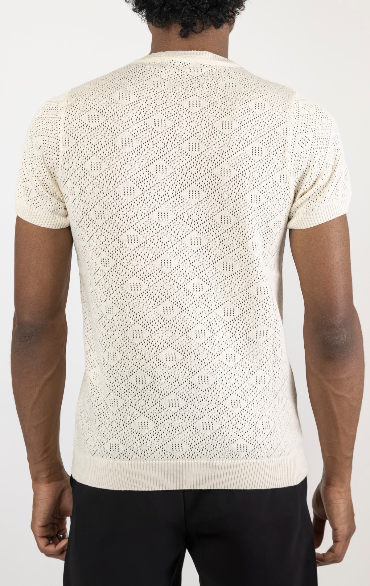 Women's geometric crochet knit top in beige. The top is made from a 50% viscose, 50% polyamide blend and features a unique geometric crochet pattern.