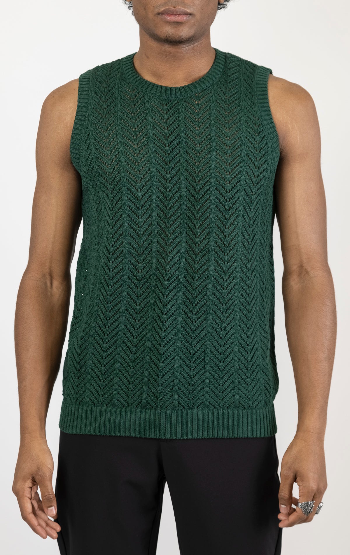Men's knit muscle fit tank top in green. The tank top is made from a 50% cotton, 50% acrylic blend and features a muscle fit cut, sleeveless construction, and a textured knit fabric.