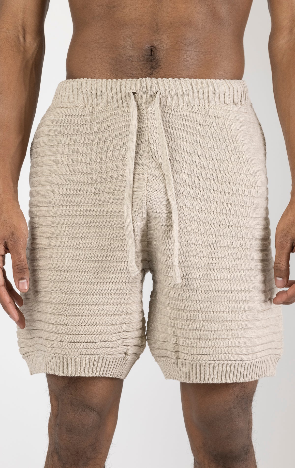 Men's stone eyelet short sleeve knit top and shorts set in a variety of colors. The set is made from a soft and breathable knit fabric (50% viscose, 50% polyamide) and features a relaxed-fit top with eyelet detailing on the short sleeves and comfortable shorts with an elastic waistband.