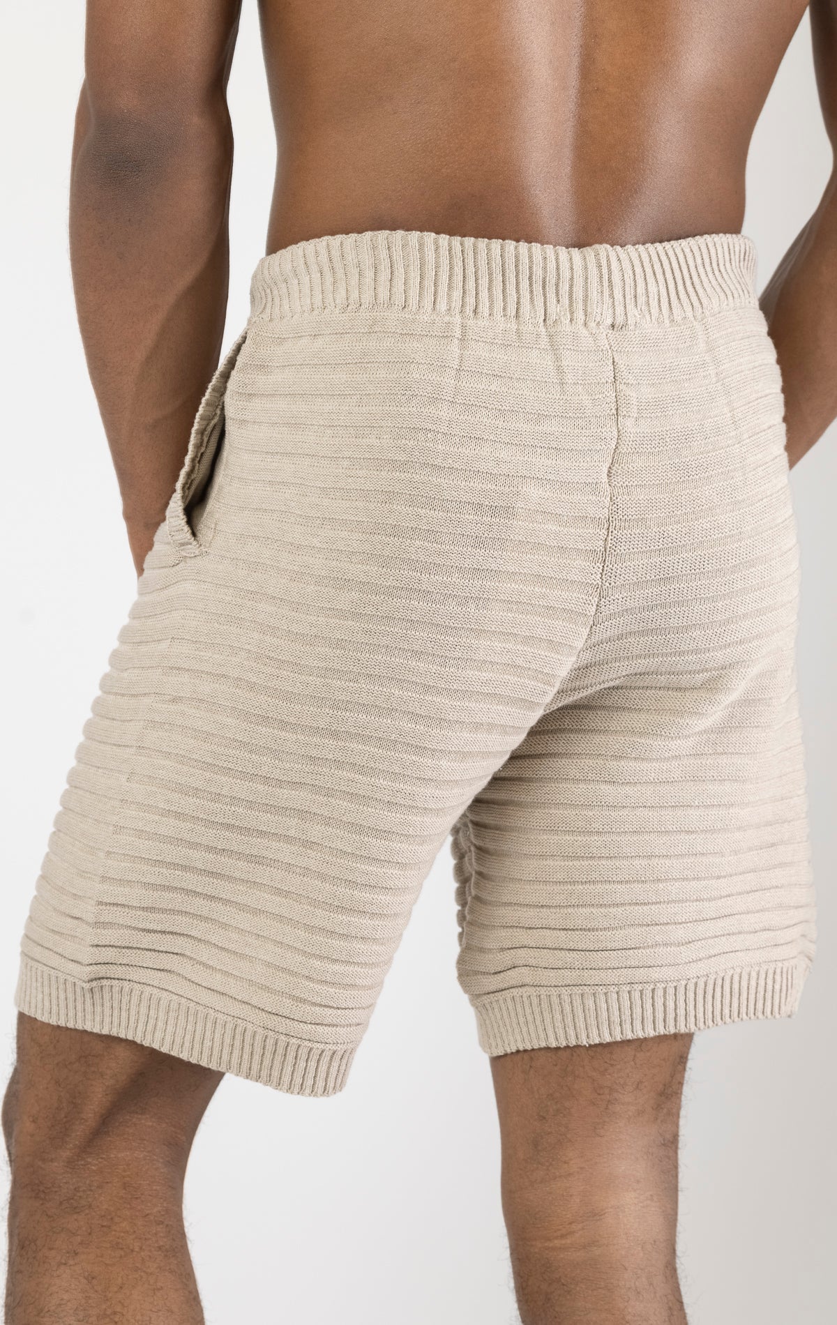 Men's stone eyelet short sleeve knit top and shorts set in a variety of colors. The set is made from a soft and breathable knit fabric (50% viscose, 50% polyamide) and features a relaxed-fit top with eyelet detailing on the short sleeves and comfortable shorts with an elastic waistband.