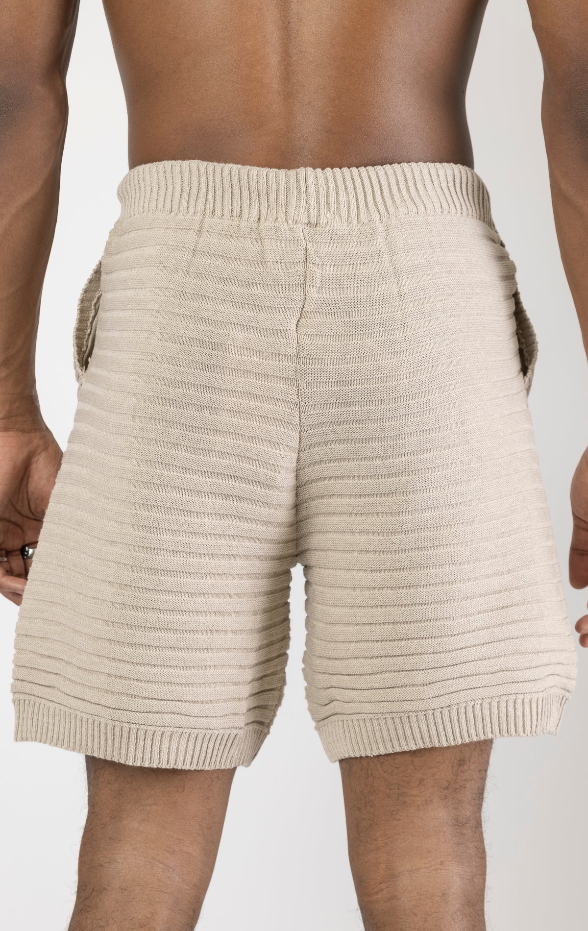 Men's stone eyelet short sleeve knit top and shorts set in a variety of colors. The set is made from a soft and breathable knit fabric (50% viscose, 50% polyamide) and features a relaxed-fit top with eyelet detailing on the short sleeves and comfortable shorts with an elastic waistband.