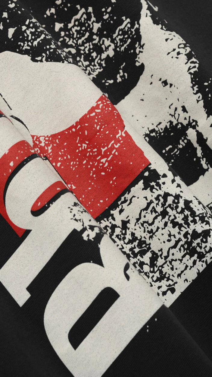 Abstract design with red square, white text, and black abstract shapes