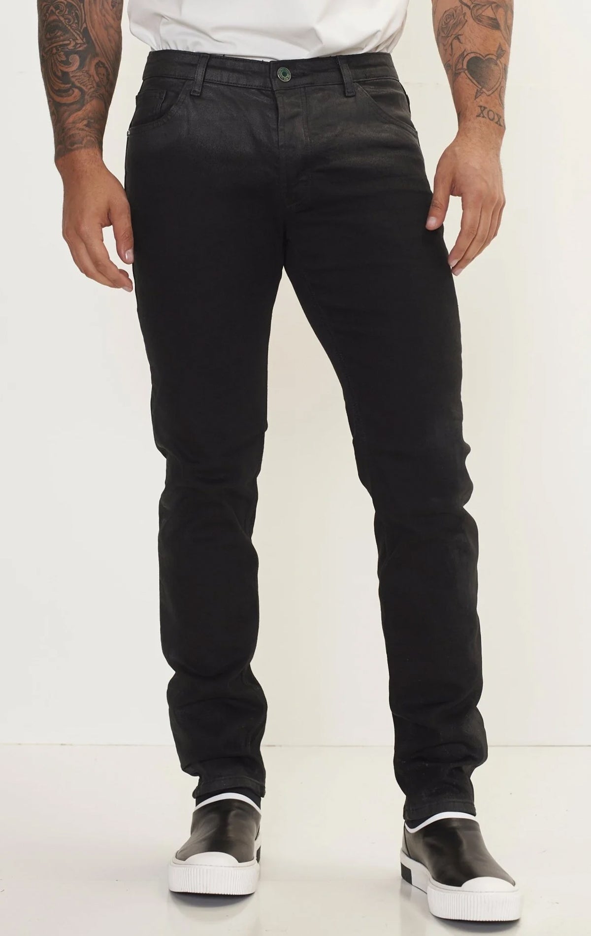 Men's side waxed tapered jeans in black. The jeans are made from premium quality denim (98% cotton, 2% lycra) and feature a tailored fit, meticulously applied waxed detailing along the side seams, and a tapered leg.