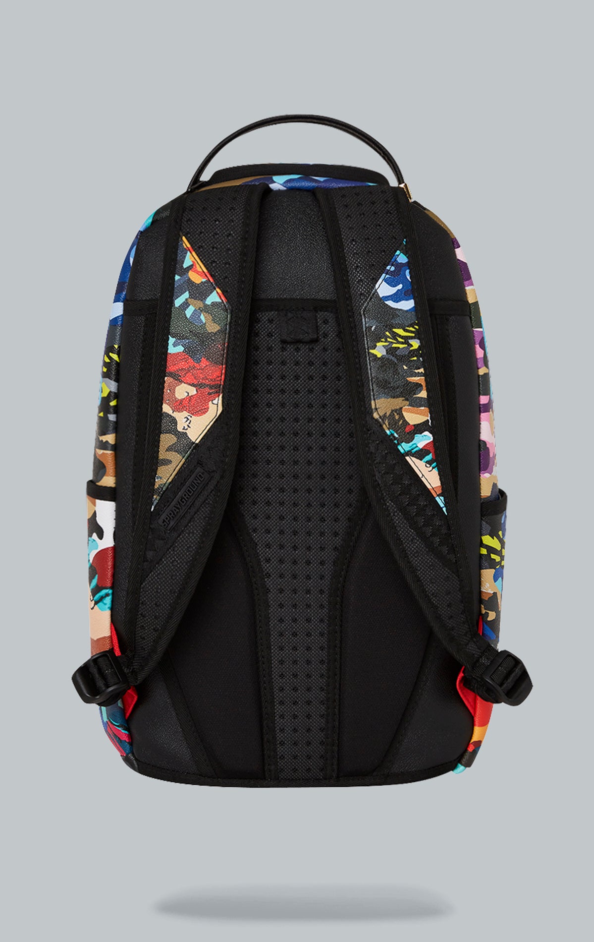 Sprayground Sliced & Dice Camo Backpack. The backpack is made from durable faux leather (100% PVC) in a camouflage print and features a variety of pockets, a separate velour sunglass compartment, ergonomic mesh back padding, adjustable straps, and a slide through back sleeve that connects to carry-on luggage.  pen_spark     tune  share   more_vert