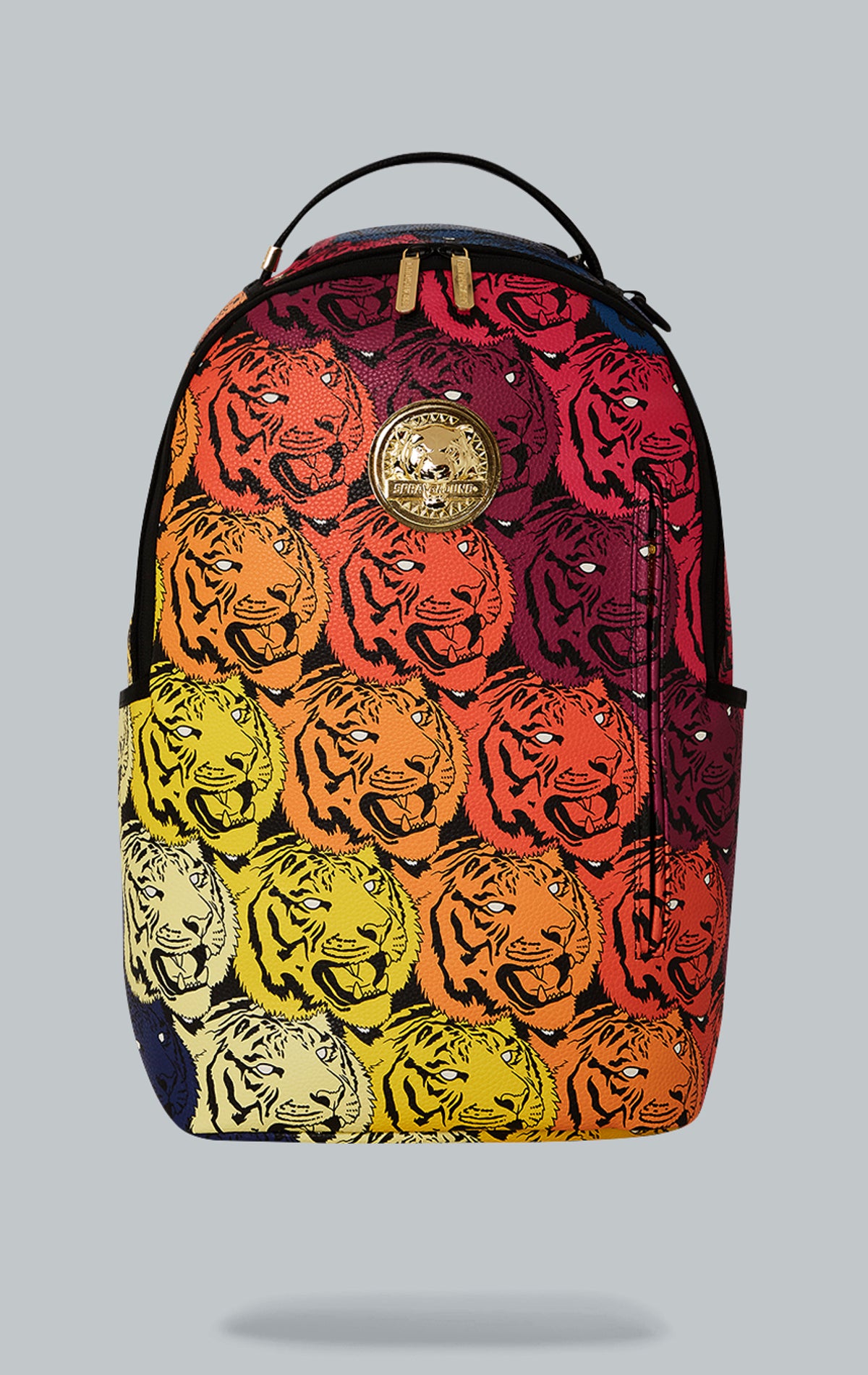 Sprayground Tigers on My Mind Backpack. The backpack is made from durable faux leather (100% PVC) and features a gold metal plated tiger emblem, a front zipper pocket, side pockets, a zippered stash pocket, a separate velour sunglass compartment, ergonomic mesh back padding, adjustable straps, and a slide through back sleeve that connects to carry-on luggage. The interior includes a separate velour laptop compartment and a mesh organizer pocket.  pen_spark     tune  share   more_vert