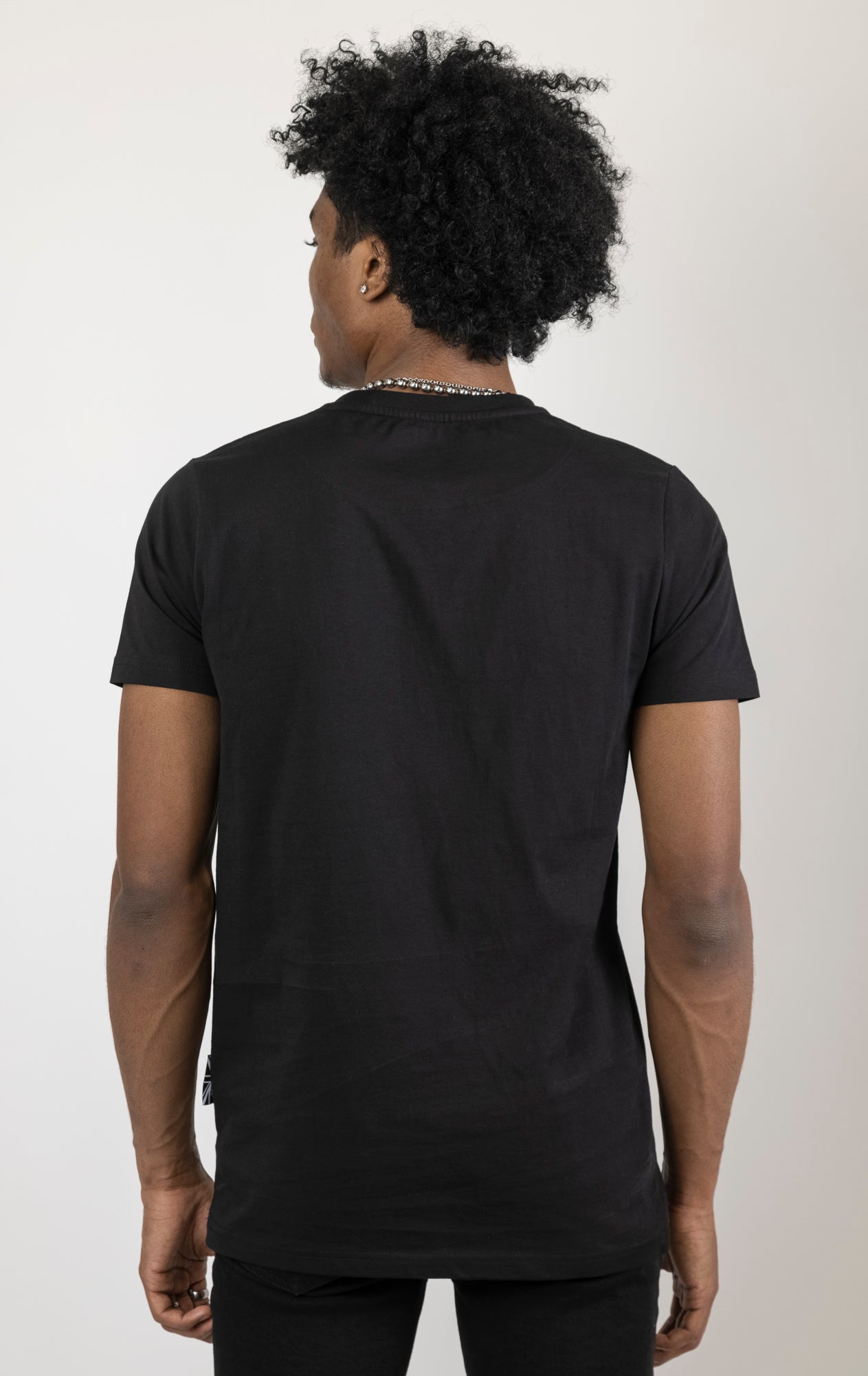 Men's regular fit t-shirt in black. The shirt features a slightly elongated sleeve, a fitted neckline, and a straight body. It has a "Serpent of the Shadows" front print with 3D embroidery. Made from 100% cotton jersey (190gsm). A "blessed" slogan is printed on the inner neck binding and a woven side seam tab with "blessed" is also included.