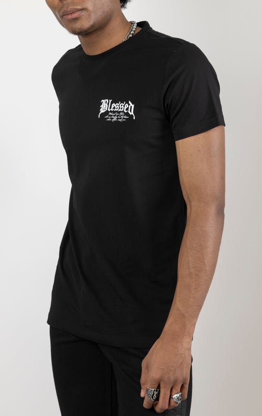 Men's regular fit t-shirt in black. The shirt features a slightly elongated sleeve, a fitted neckline, and a straight body. It has "Blessed with Beauty" printed on the front and back with 3D embroidery.  Made from 100% cotton jersey (190gsm).  A "blessed" slogan is printed on the inner neck binding and a woven side seam tab with "blessed" is also included.