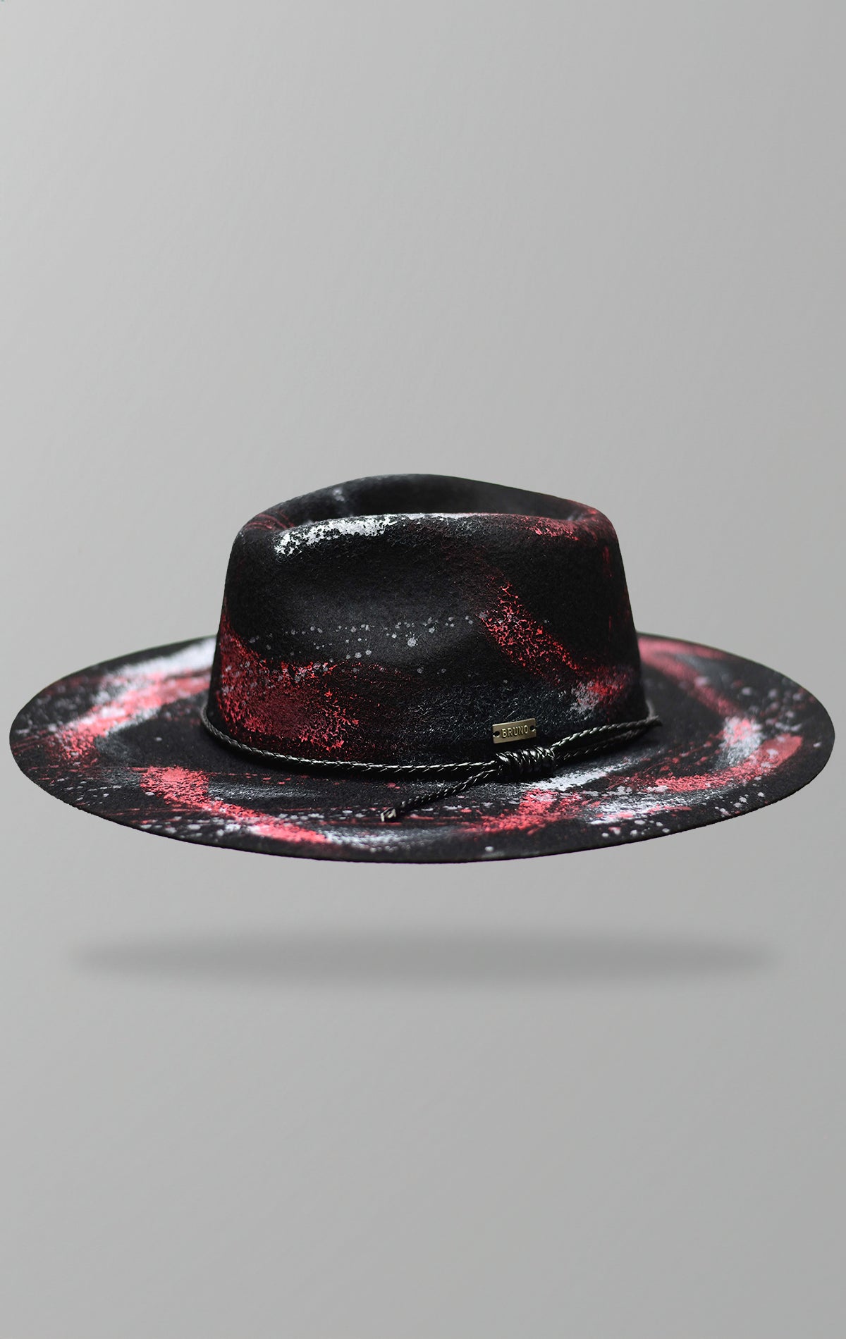 Hand-painted Australian wool hat with adjustable sizing and vegan rope band.