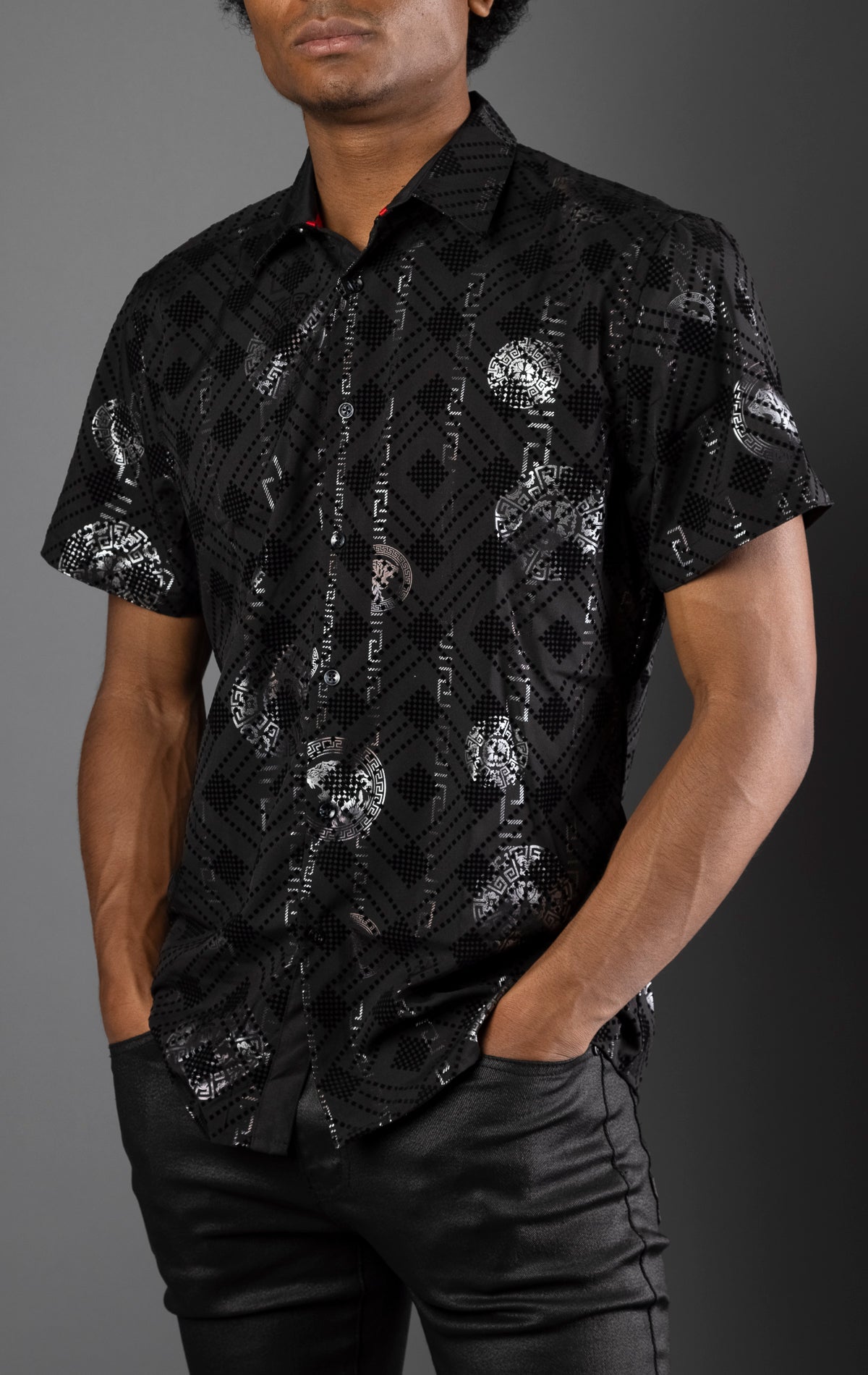 black Men's casual, relaxed-fit button-down shirt with a short sleeve design. The shirt features an all-over Greek key pattern and a front button closure.