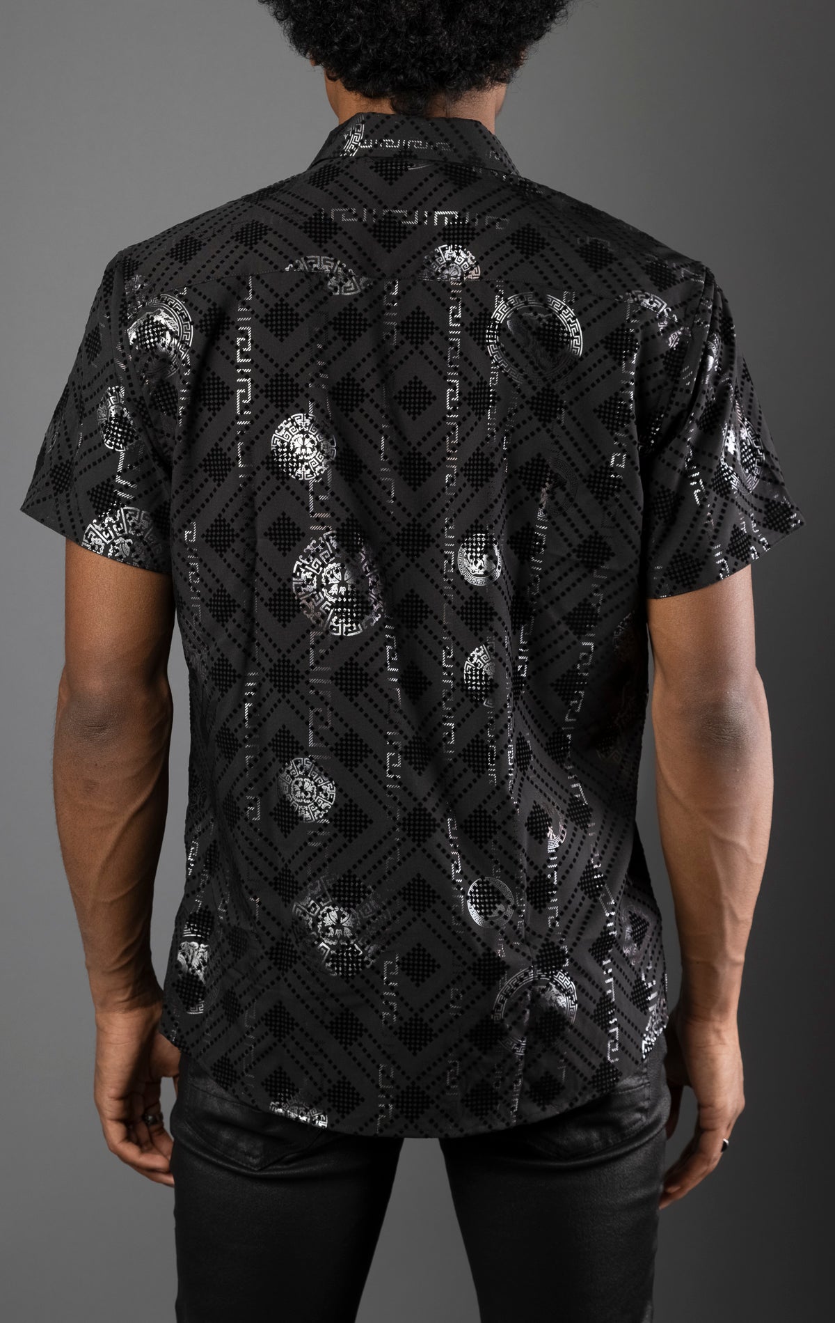 Black Men's casual, relaxed-fit button-down shirt with a short sleeve design. The shirt features an all-over Greek key pattern and a front button closure.
