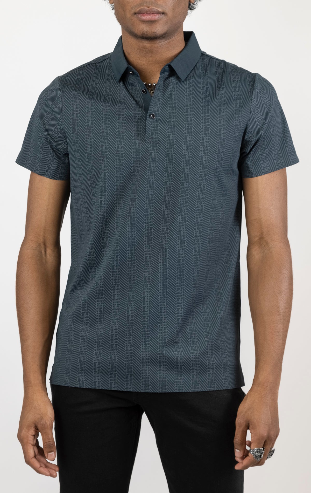 Men's versatile stretch polo shirt in navy. The polo is made from an 87% nylon, 13% spandex blend and features a seamless pattern design, a classic polo collar with buttons, and short sleeves.