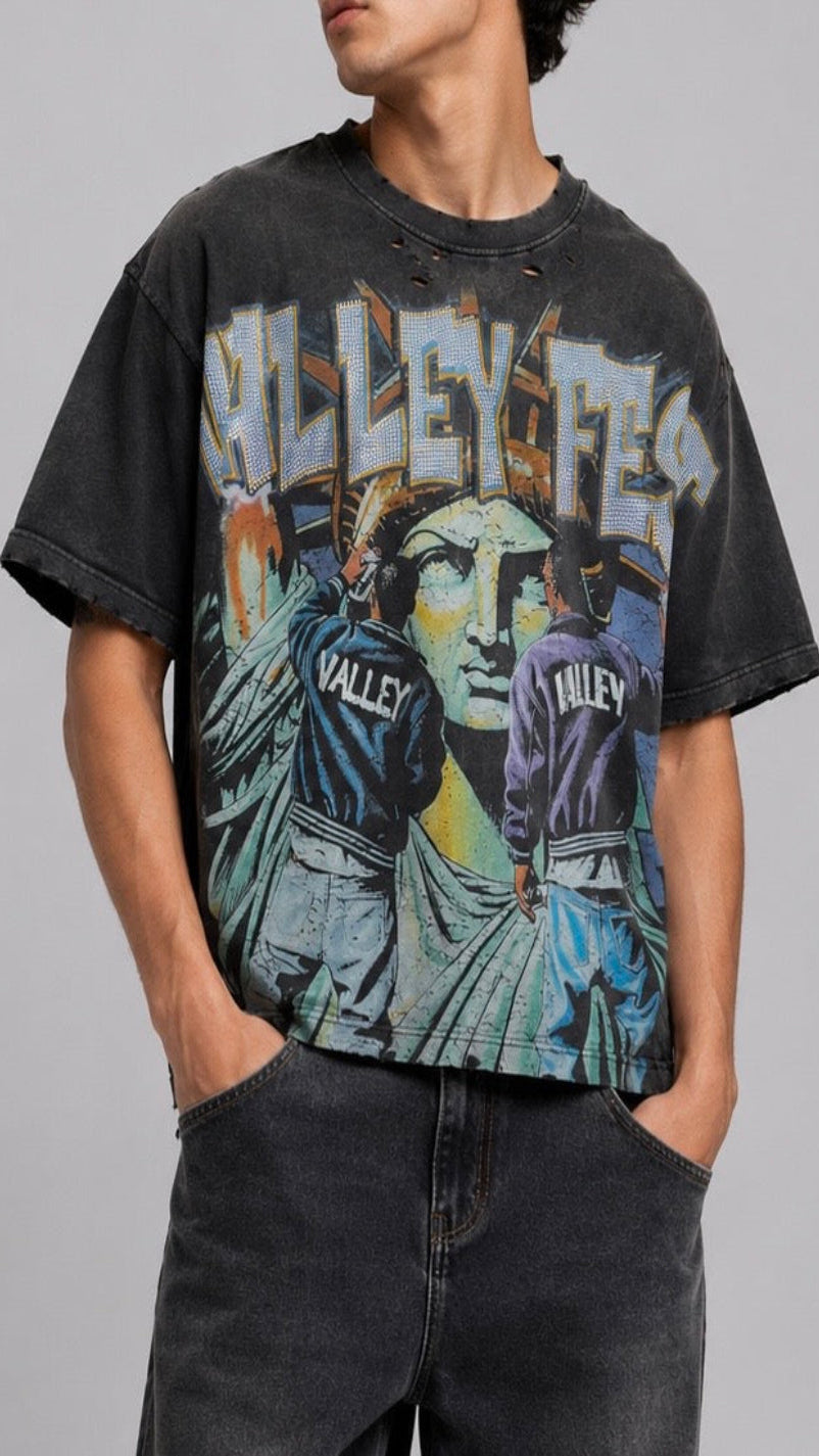 Person wearing a black t-shirt with graphic design and text