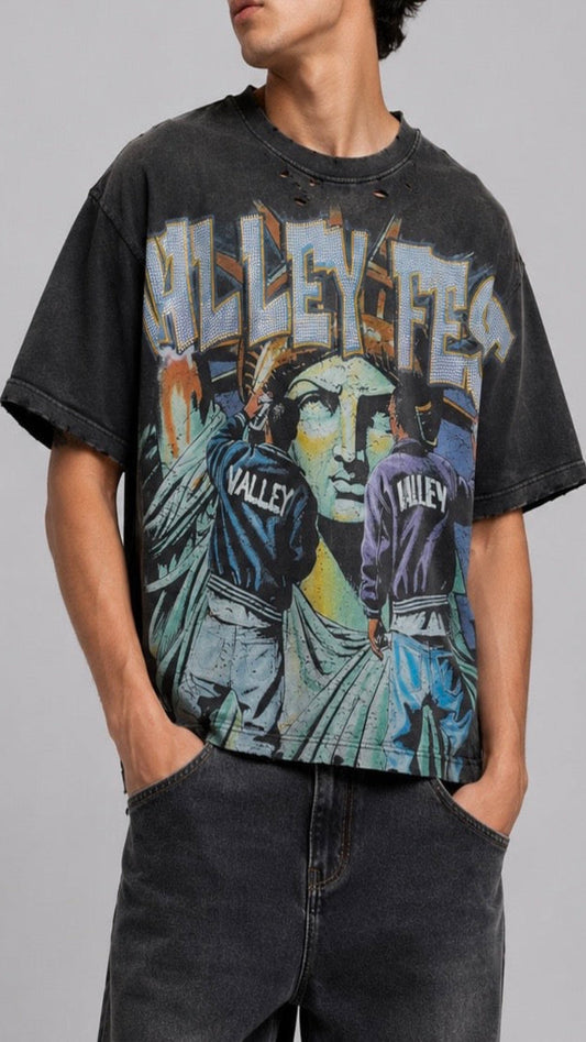 Person wearing a black t-shirt with graphic design and text