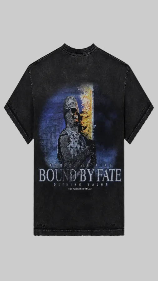 A black acid-wash graphic t-shirt featuring a large print of a Viking warrior with a helmet, set against a blue and yellow background, with the text 'BOUND BY FATE' 