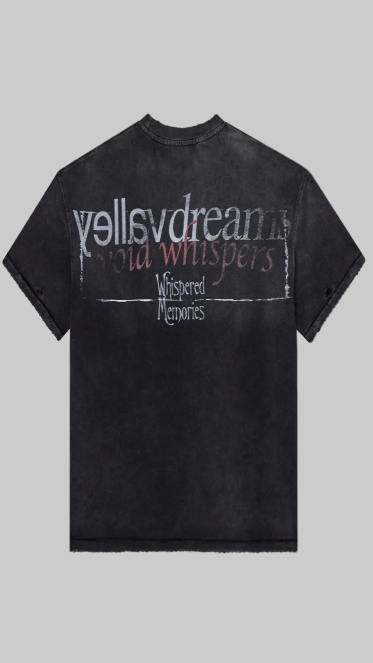 A washed black short-sleeve t-shirt with a distressed graphic print on the front reading 'yellavdreams", "void whispers" and "Whistpered Memories" in white and red lettering, shown against a plain white background.