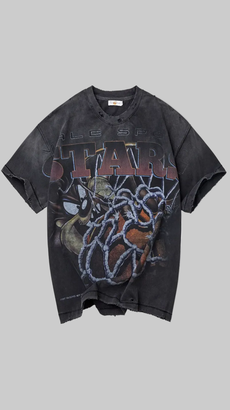 Black t-shirt with graphic design on a grey background