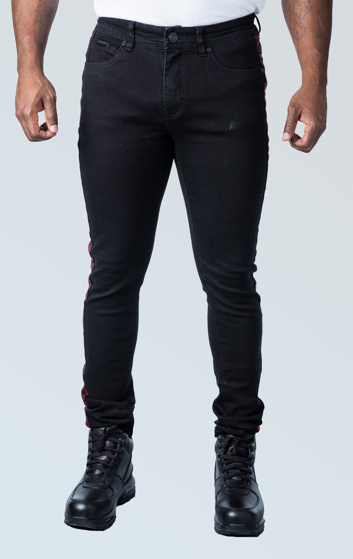 Men's slim-fit jeans in a dark wash with a Greek key design throughout the fabric. The jeans have a regular waist, five pockets, a zip fly with button closure, and a 32-inch inseam. Made from a comfortable blend of 70% cotton, 28% polyester, and 2% spandex.