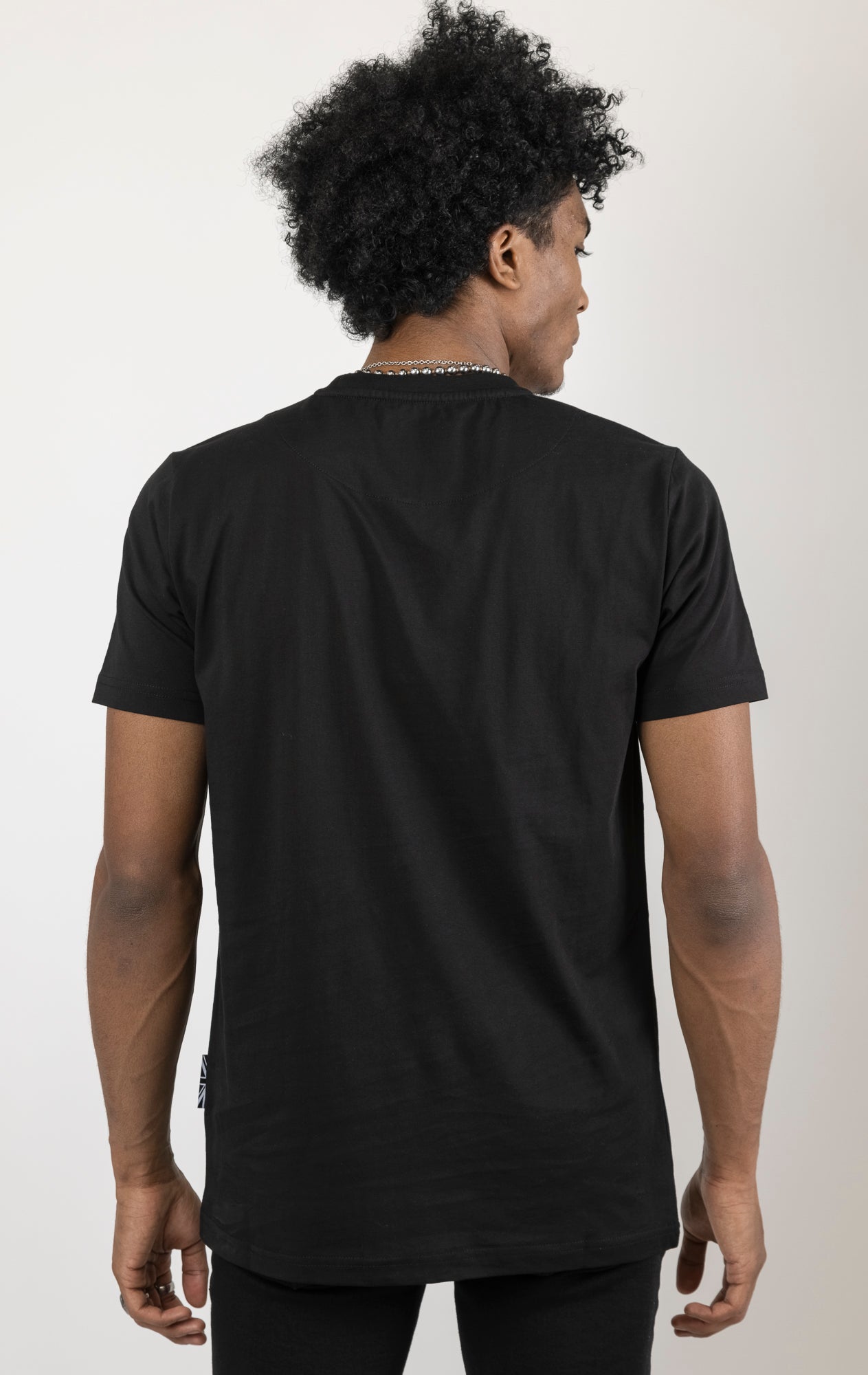 Men's regular fit t-shirt in a variety of colors. The shirt features a slightly elongated sleeve, a comfortable fit through the shoulders and body, and a "Weight of Expectations" front print with 3D embroidery.  Made from 100% cotton jersey (190gsm).  A "blessed" slogan is printed on the inner neck binding and a woven side seam tab with "blessed" is also included.