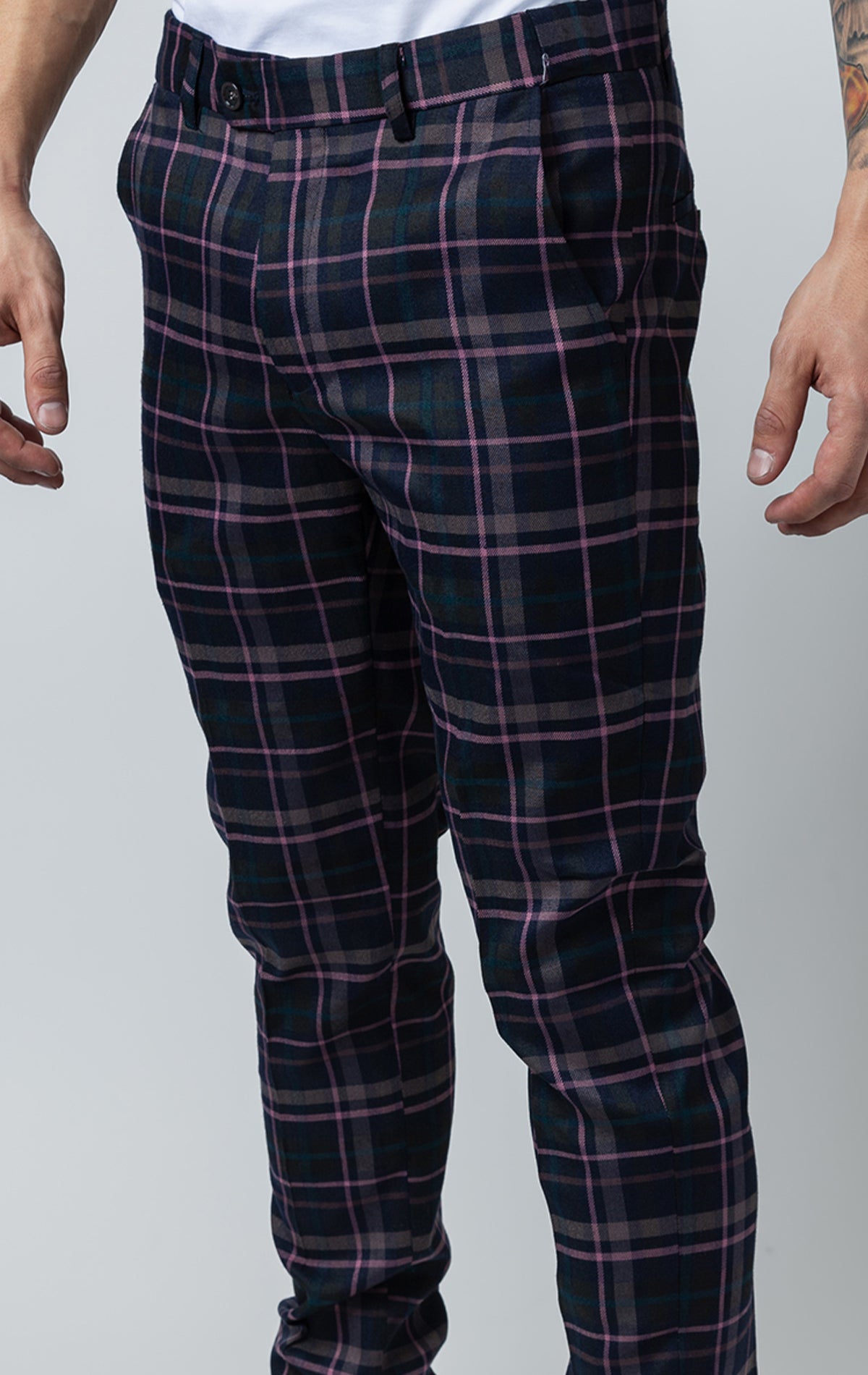 Men's purple chino pants with a checkered plaid design. The pants feature an elastic waistband for comfort and stretch, and are made from a lightweight cotton-spandex blend fabric. Inseam is 32 inches.