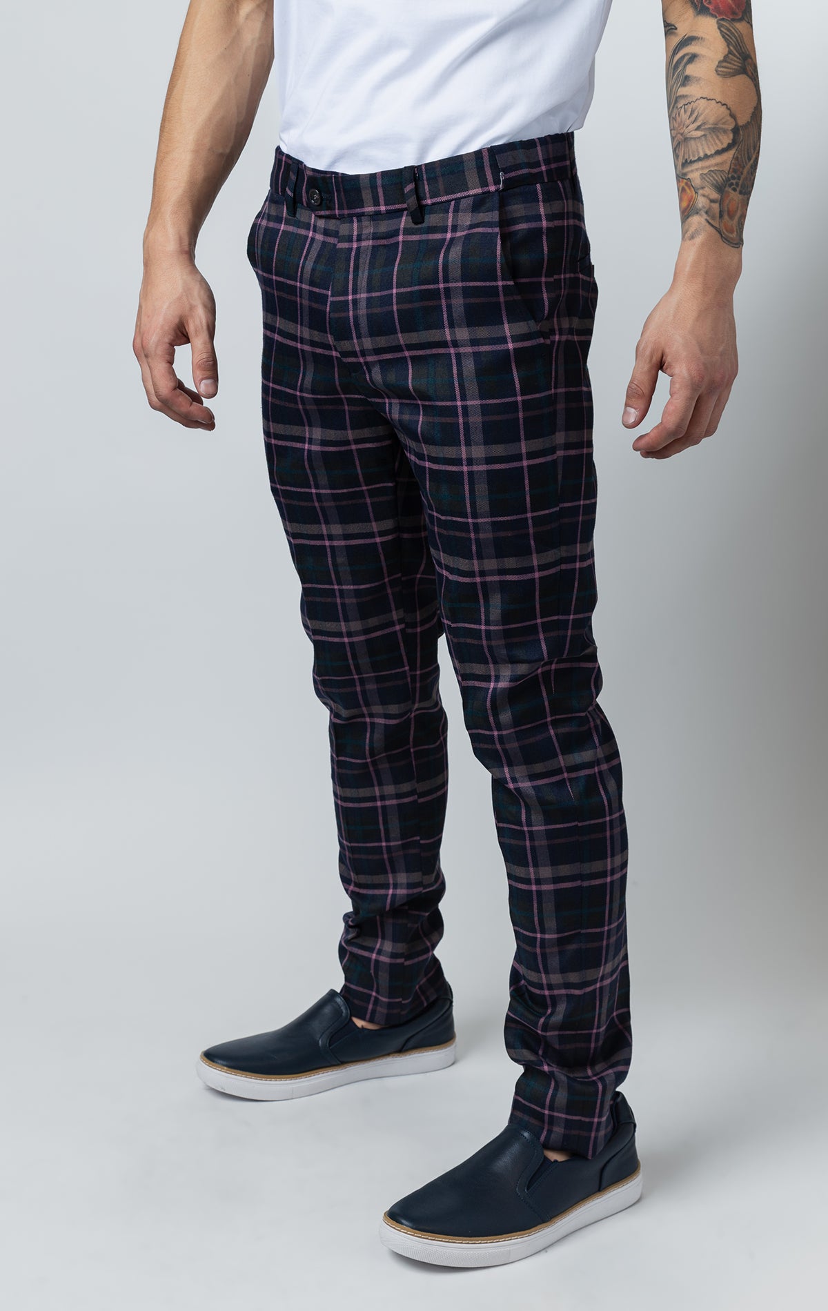 Men's purple chino pants with a checkered plaid design. The pants feature an elastic waistband for comfort and stretch, and are made from a lightweight cotton-spandex blend fabric. Inseam is 32 inches.