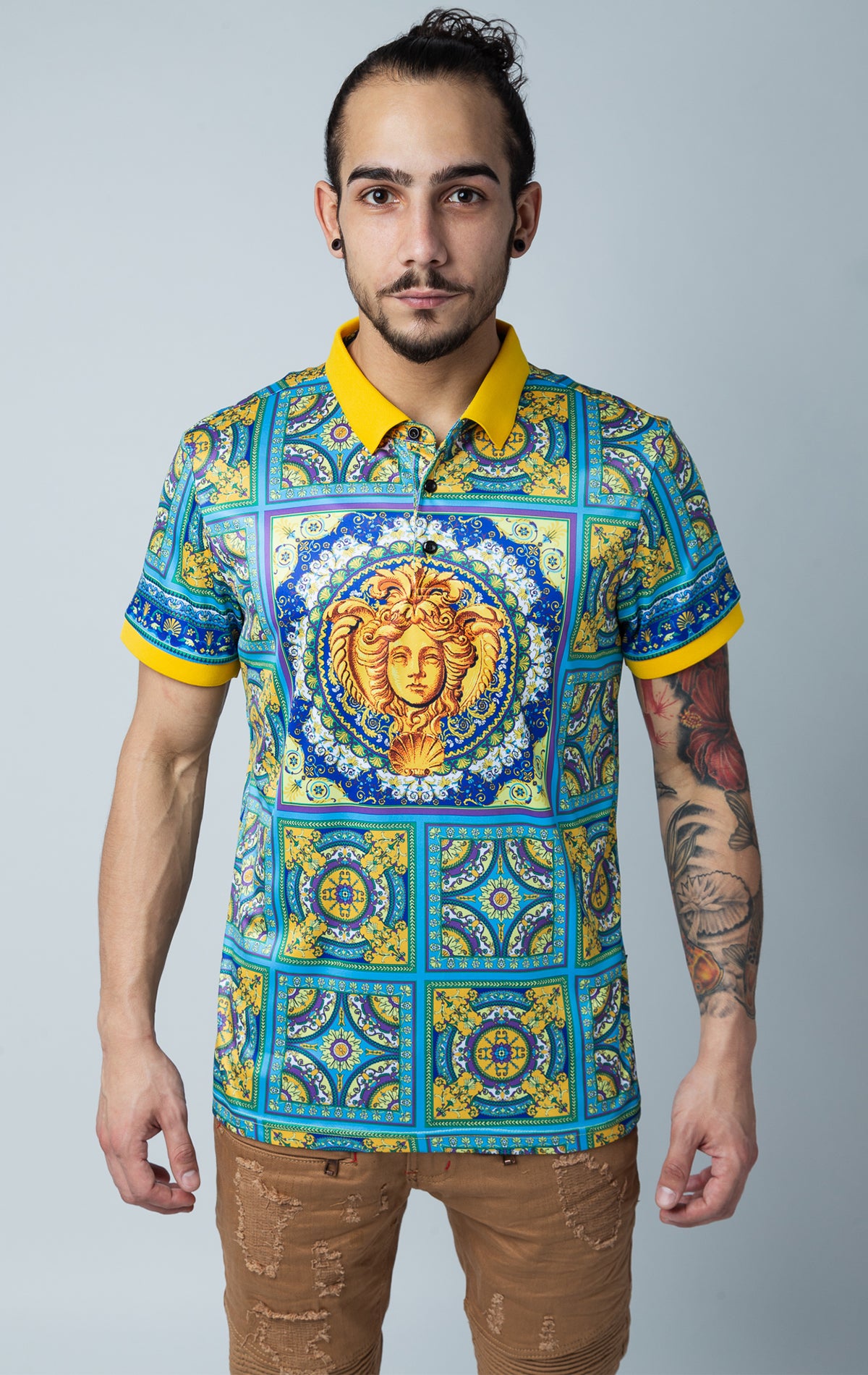 Stylized print polo shirt with collared detailing, short-sleeved composition, three button front fastening, luxuriously-crafted cotton blend.