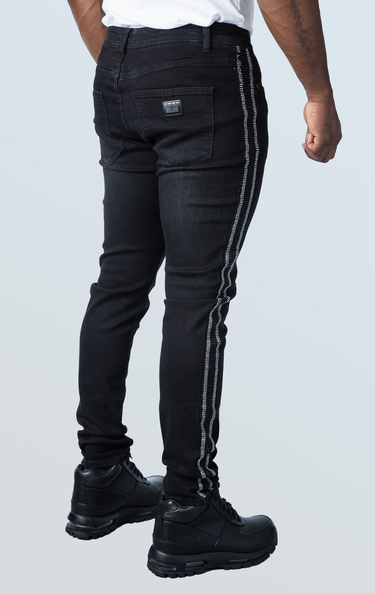 Black premium denim pants with unique side strip design.