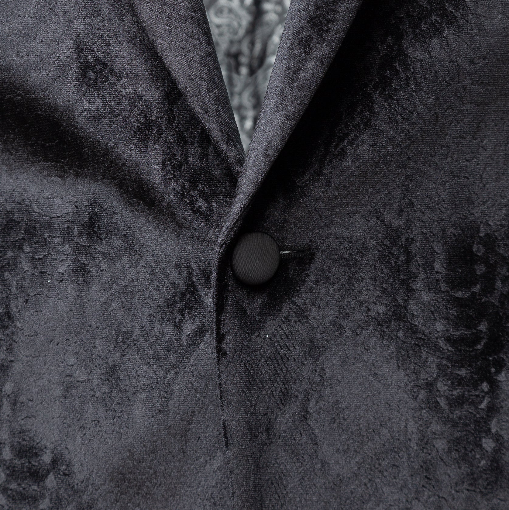 Black blazer with an exquisite velvet design finish.